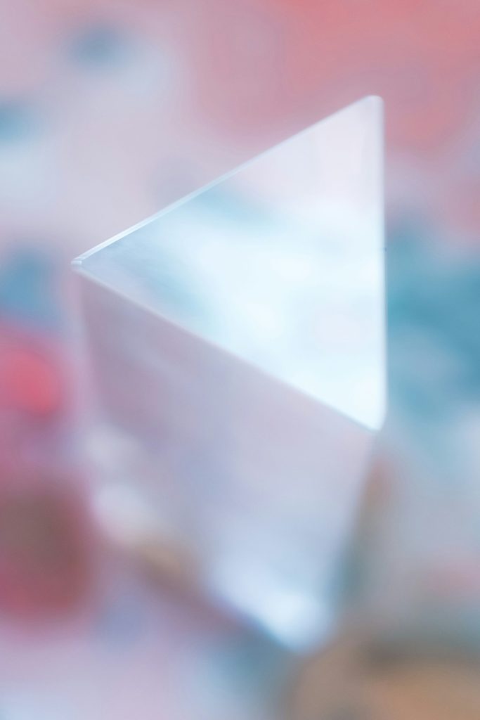 white and blue paper on red textile